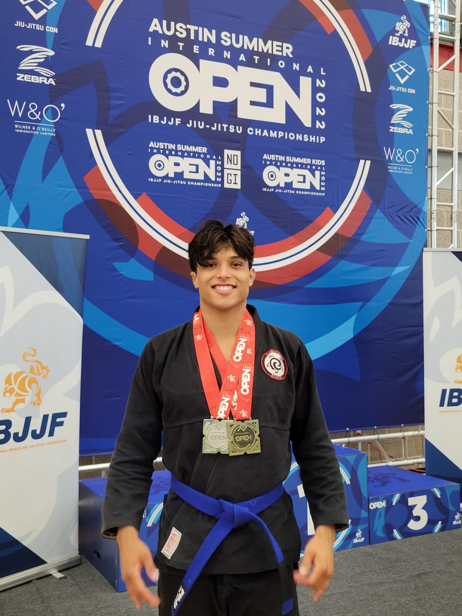 Fabrizio Pari smiling with his competition medals